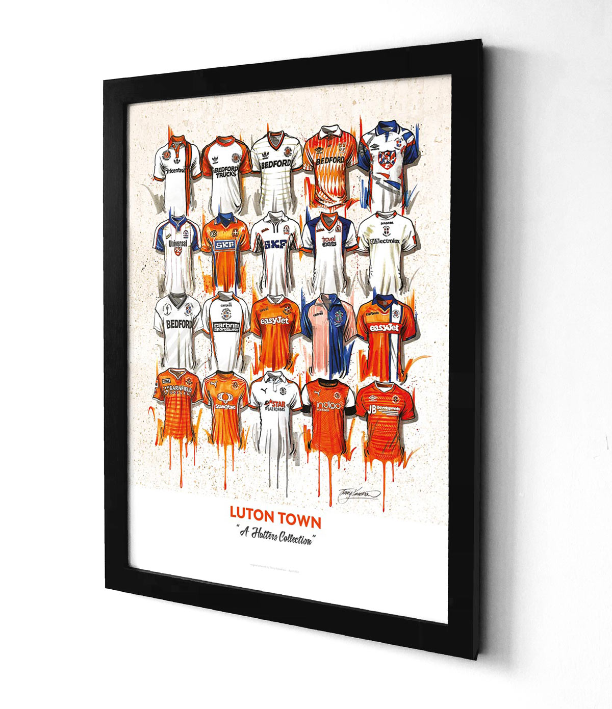 featuring 20 iconic jerseys from the team. The jerseys are arranged in a grid pattern, with the Luton FC crest at the centre. The jerseys feature different designs and colours, representing different eras of the team's history. The print is A2 size and is a limited edition print.