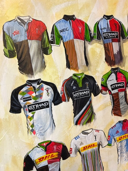 This limited edition A2 print by Terry Kneeshaw features 20 iconic Harlequins Rugby team jerseys, each personalized with a name and number of your choice. The artwork showcases the team's rich history and includes classic kits worn by legendary players. The print is a must-have for any Harlequins fan or rugby enthusiast and is sure to be a conversation starter in any room. The vibrant colors and attention to detail make this artwork a truly unique and special addition to your collection.