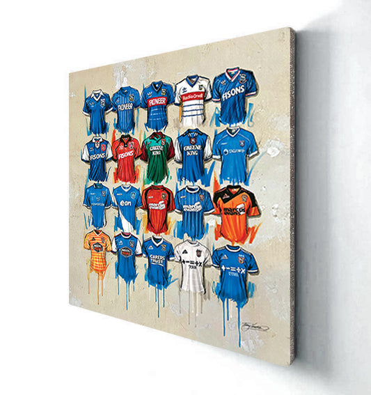 These stunning Ipswich Town Football Club canvases by Terry Kneeshaw are available in various sizes including 20x20. The canvases are framed or unframed with a black floating frame. The art pieces capture the beauty of the club's logo, emblem, and stadium. A perfect way to display your support for the Tractor Boys in your living room, bedroom or office.